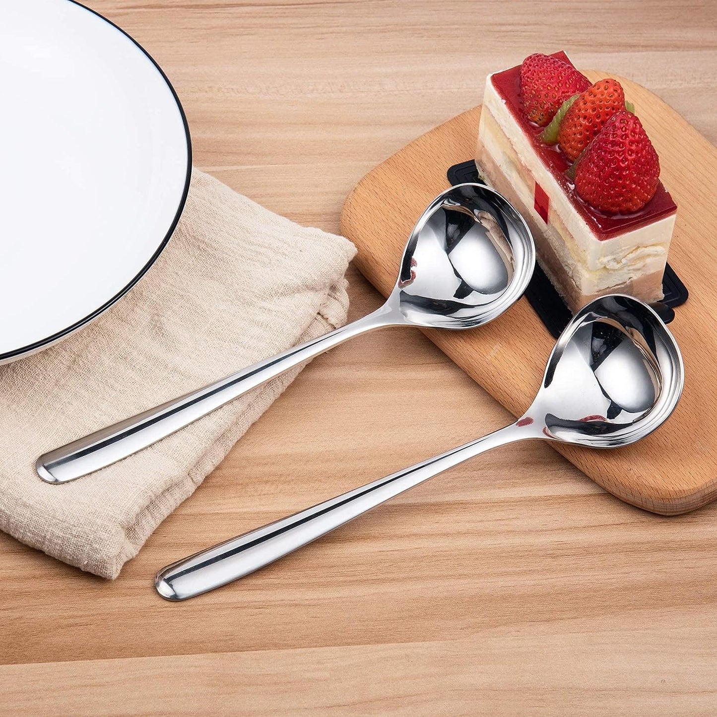 IMEEA SUS304 Stainless Steel Gravy Ladles placed on a table in a home dining setting