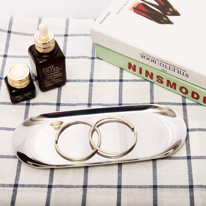 Jewelry Storage Tray holding bracelets and accessories on tablecloth