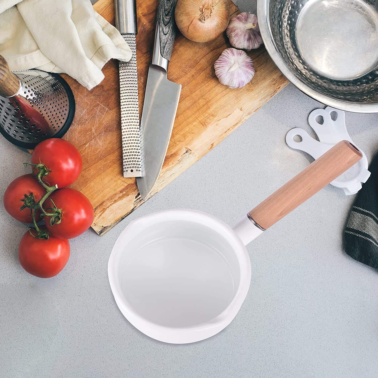 IMEEA enamel saucepan displayed on a kitchen counter with a wooden handle and dual pour spouts