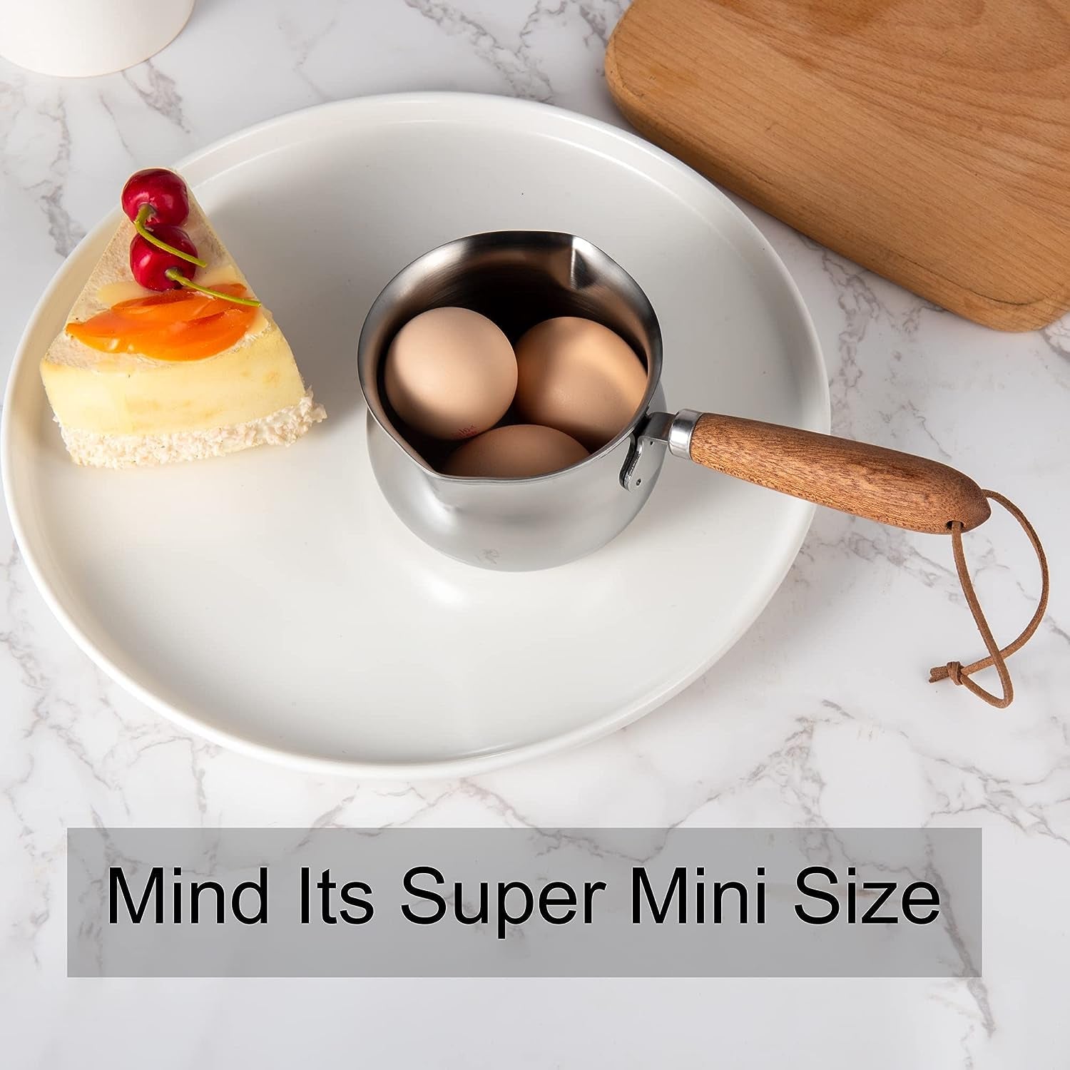 IMEEA Super Mini Stainless Steel Sauce Pan showing compact size with eggs and cake for comparison