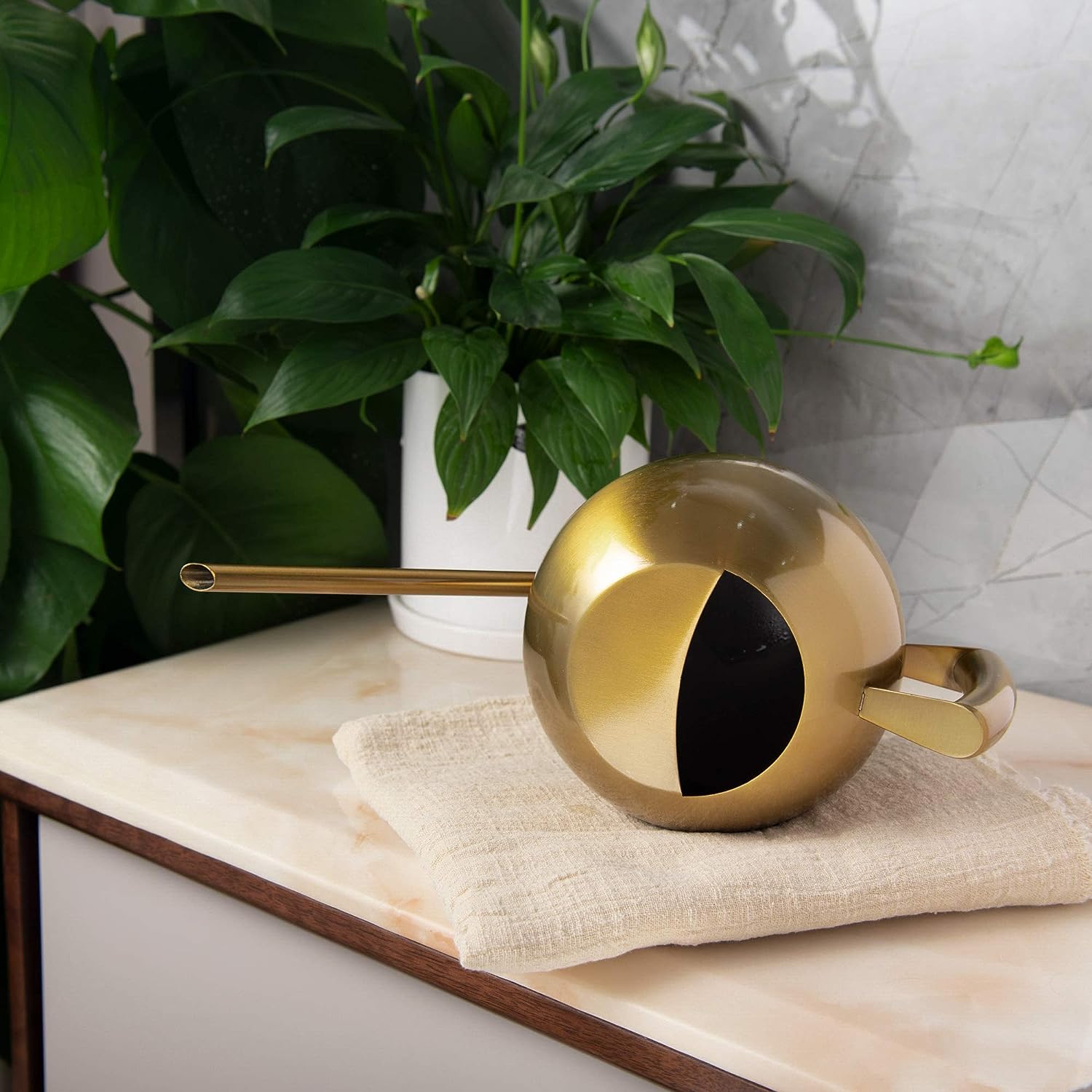 Bronze Stainless Steel Watering Can displayed horizontally with semi-open top design