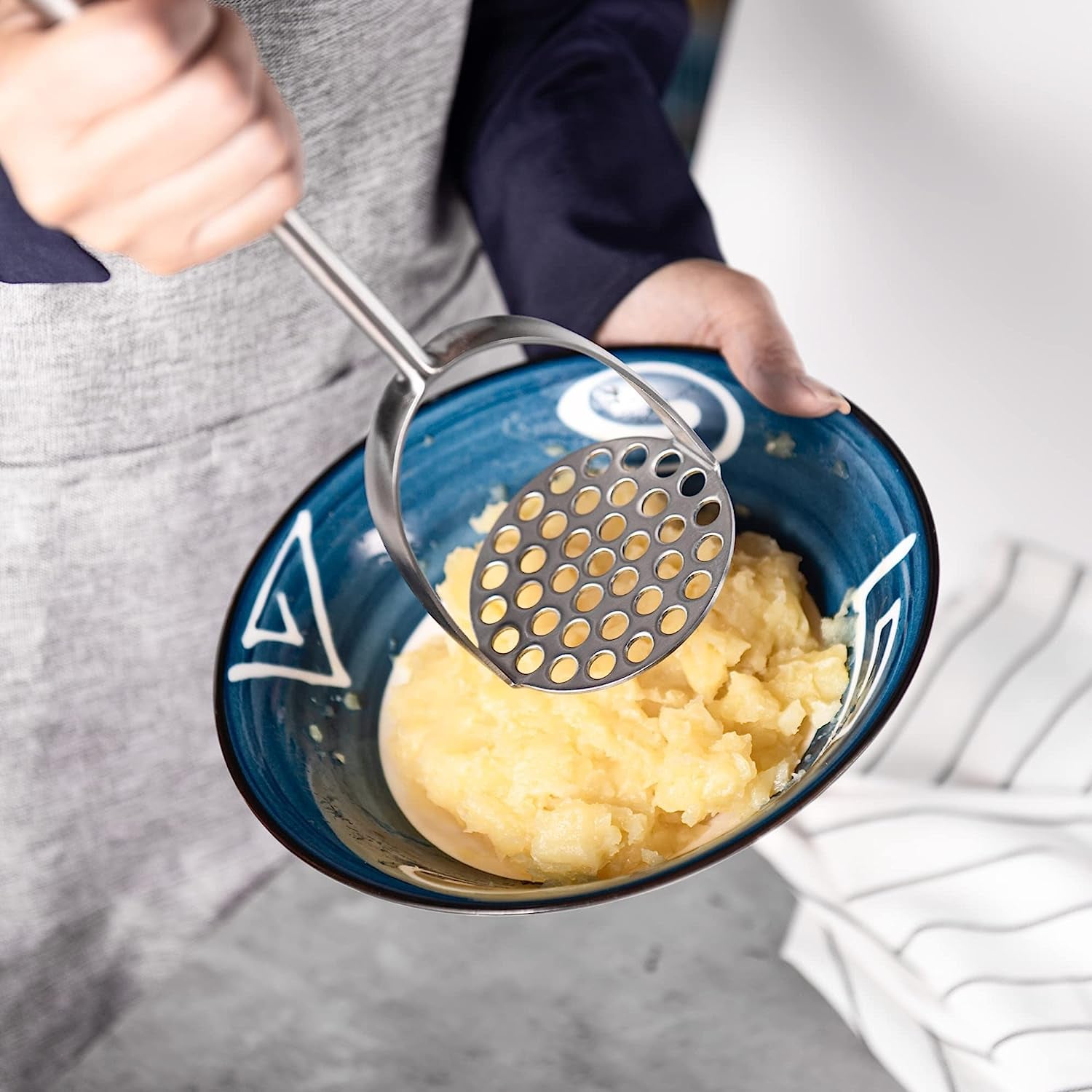 Long Handle Stainless Steel Potato Masher used for mashing potatoes