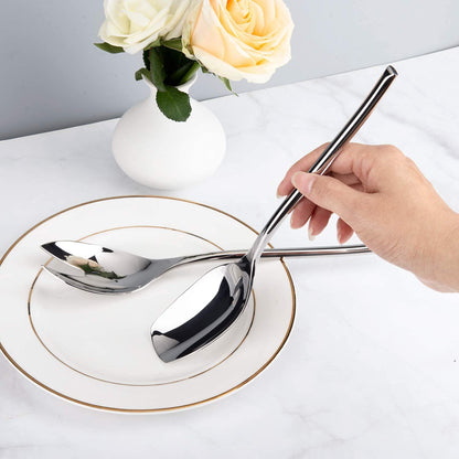 Morden Salad Servers 18/10 Stainless Steel spoon and fork set held in hand at the dining table