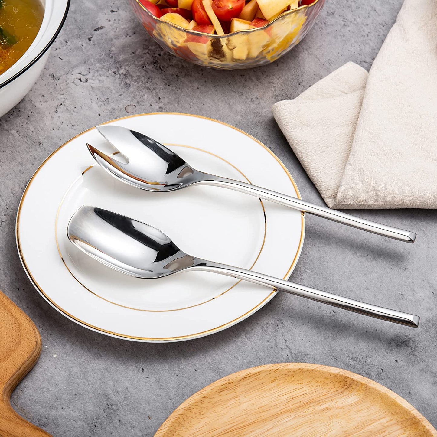 Elegant IMEEA Salad Servers 18/10 Stainless Steel spoon and fork set displayed on a plate