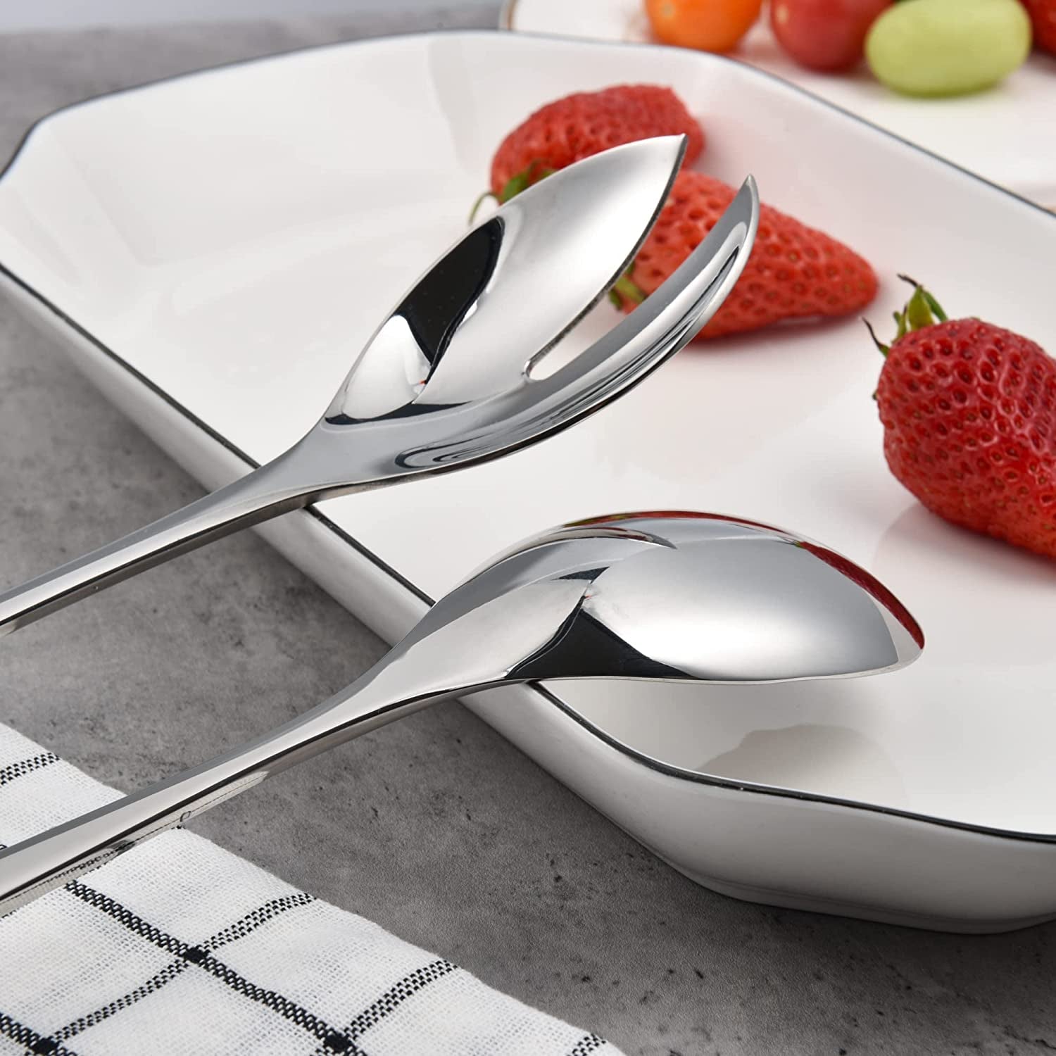 18/8 Stainless Steel Salad Servers with detailed spoon and fork heads on a dining plate