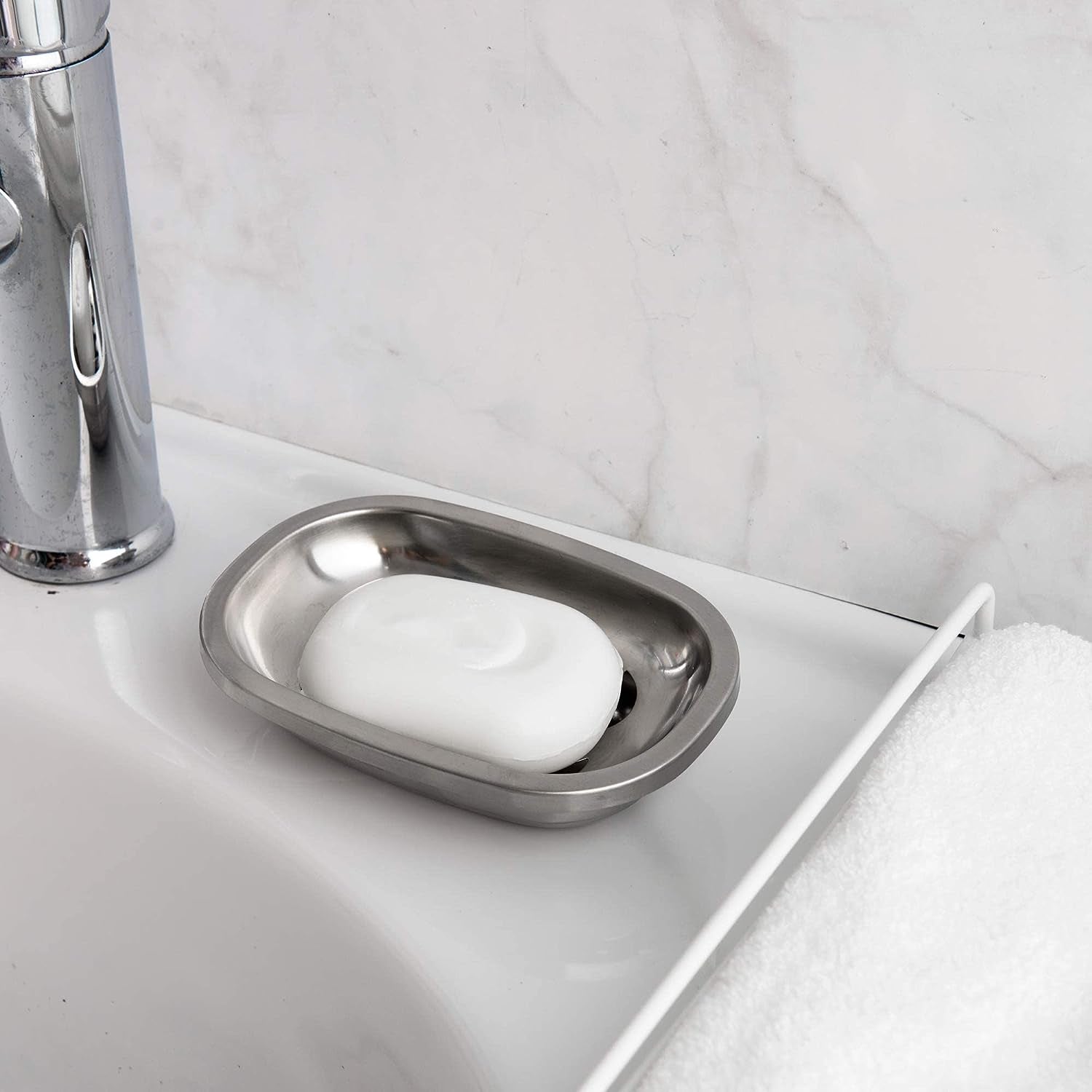 Brushed Stainless Steel Soap Dish with soap placed beside the bathroom sink for everyday use