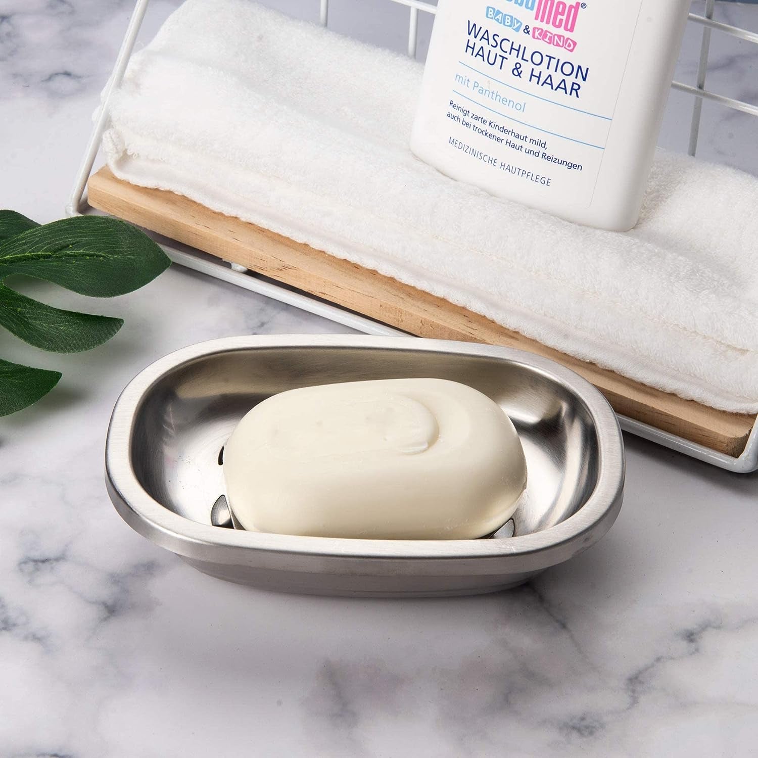 Polished SUS304 Stainless Steel Soap Dish placed on a bathroom counter with a simple and clean design