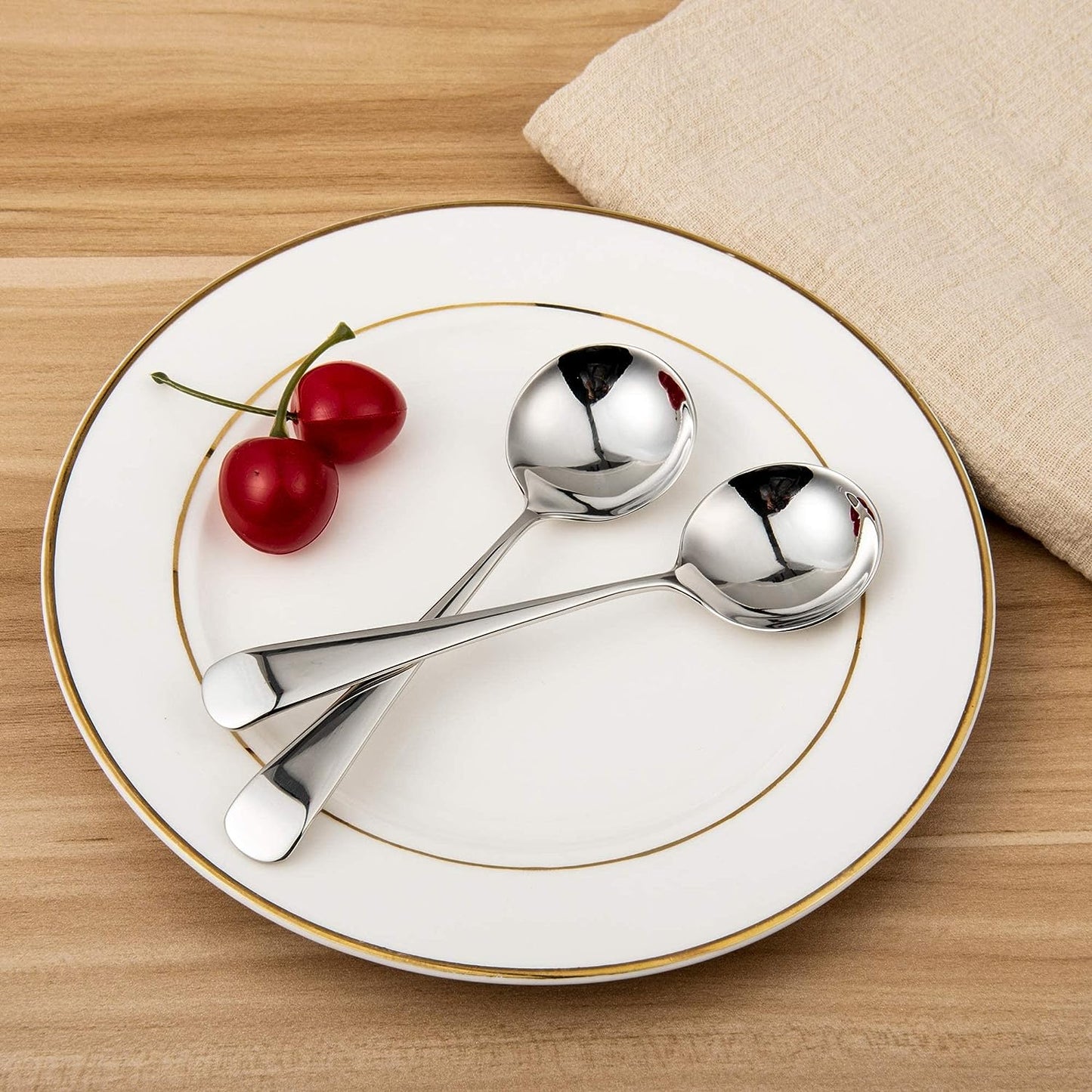 Stainless Steel Soup Spoon resting on a plate with a polished reflective surface
