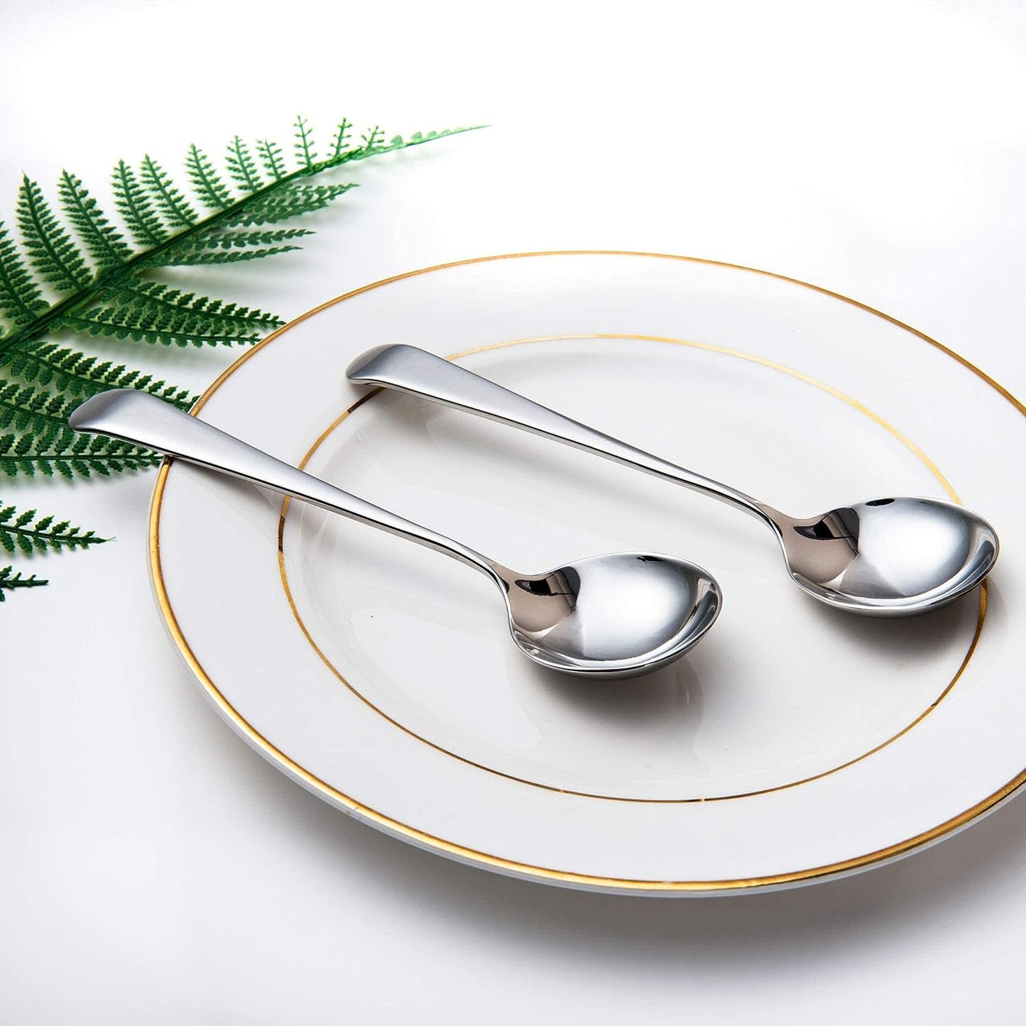Stainless Steel Soup Spoon resting on a plate as part of a refined dining setup