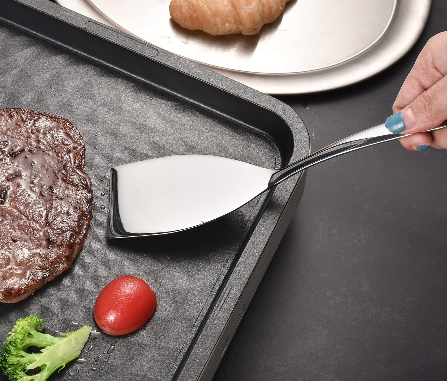 IMEEA Small Spatula placed on a steak grill for cooking applications