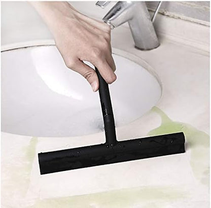 IMEEA Silicone Shower Squeegee removing spilled water from a bathroom sink for quick surface cleaning