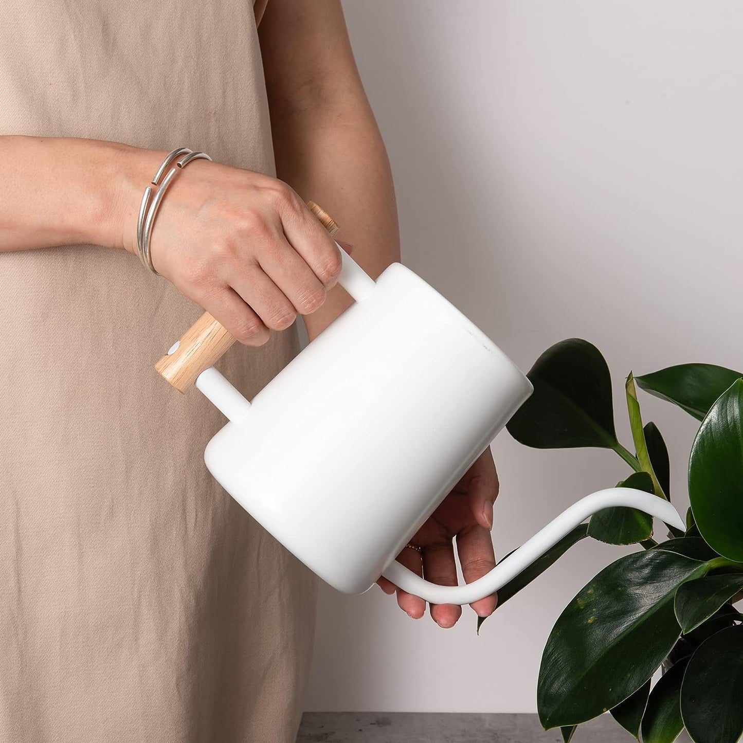 Indoor Plant Watering Can with white stainless steel body and long spout watering houseplants with precision
